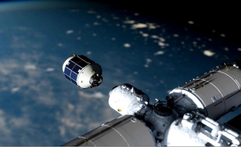 La imagen simulada muestra la nave de carga de próxima generación de China, Qingzhou, acoplándose a la estación espacial de China en órbita. (Academia de Innovación para Microsatélites de la Academia de Ciencias de China/Folleto vía Xinhua)